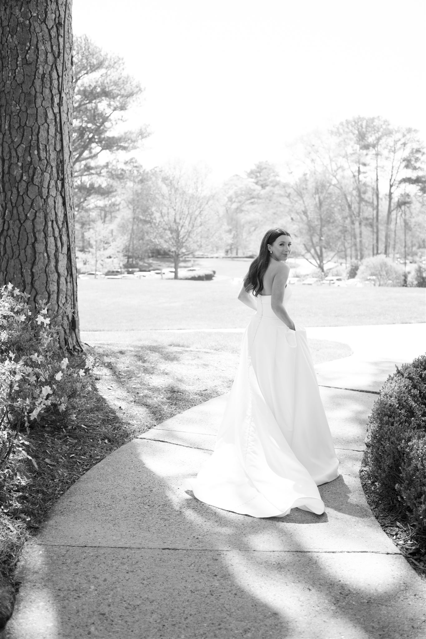 romantic timeless bride bridal portrait looking over shoulder wedding dress with pockets in atlanta photographer fine art film hannah forsberg